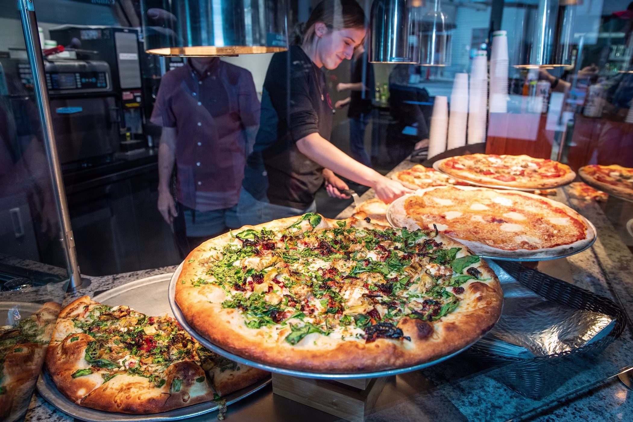 Tasty pizzas at a Jackson Hole, Wyoming restaurant. Membru connects tourists with local gastronomy for authentic flavors.